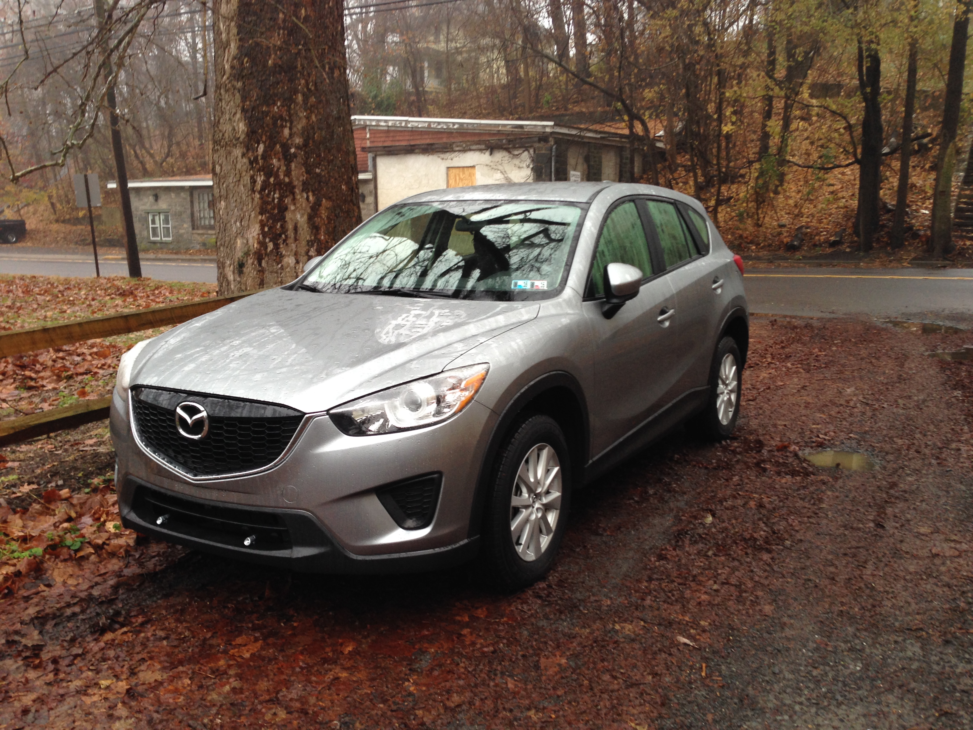 Silver Mazda CX-5 in autumn.