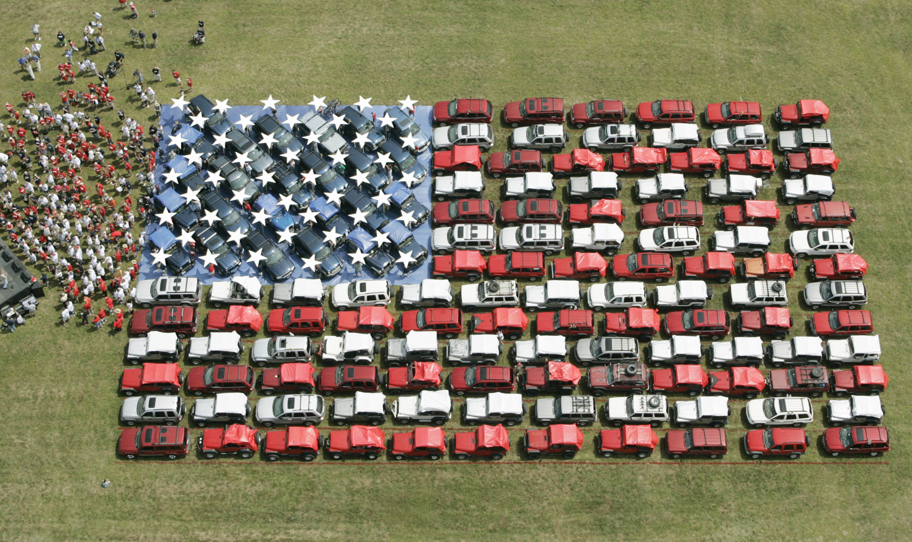 American flag made out of assorted Jeeps.